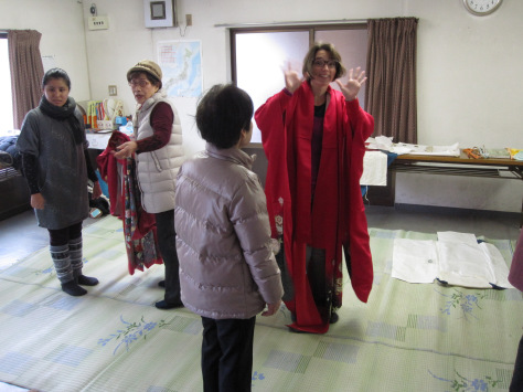 M with the kimono draped to check the colour. She looks great in red!