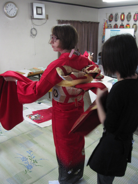 The yellow towel-like tie covers the pillow.