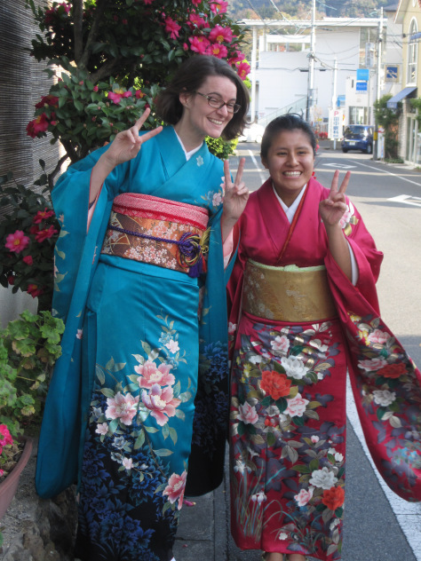 My friend and I wearing kimono. Look at those flowing sleeves! (also the flowers behind us even though it is December.